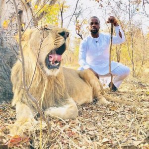 Adebola Williams takes a stroll with a Lion, celebrities reacts (Video)